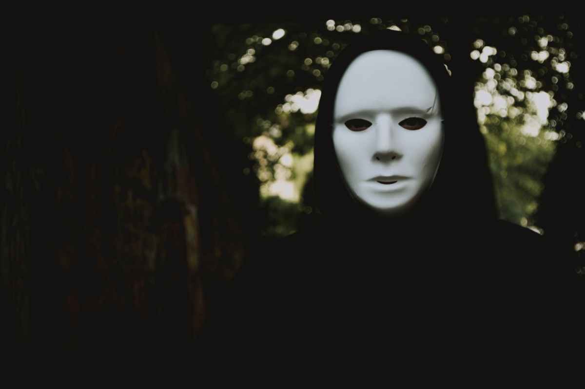 selective focus photography of person wearing mask